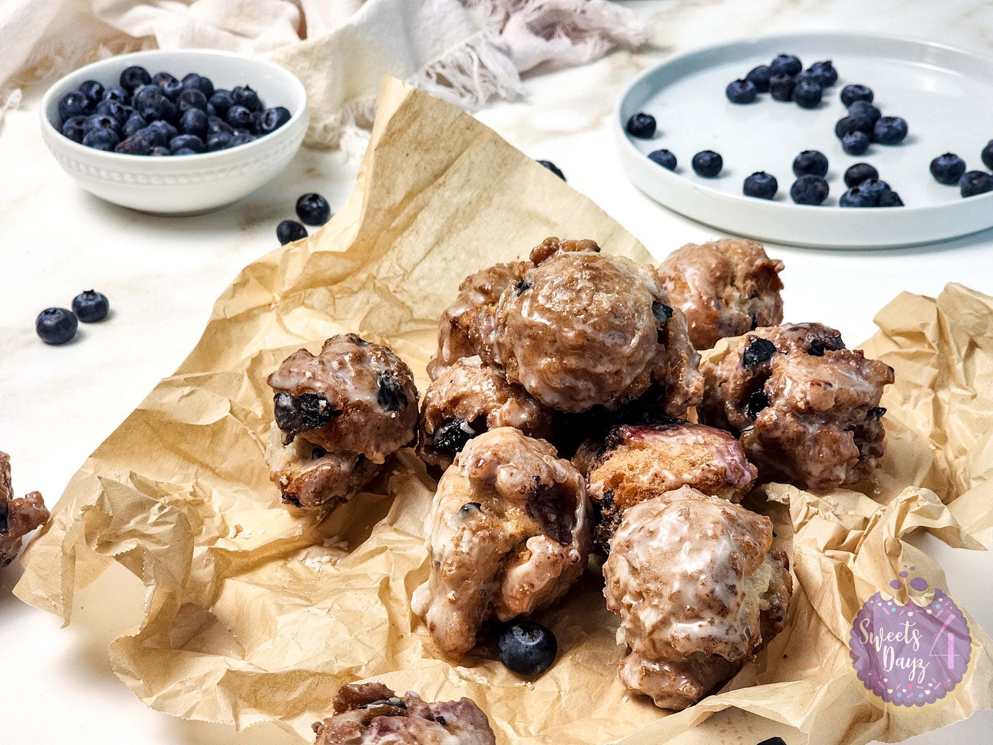 Blueberry Donut Holes on Gold Marble
