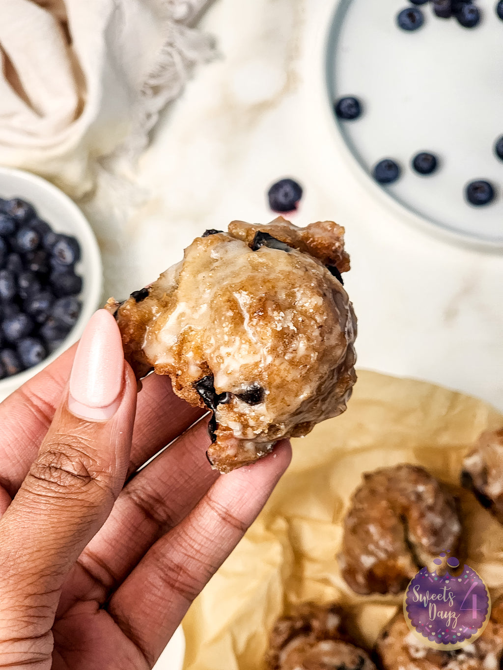 Blueberry Donut Holes on Gold Marble